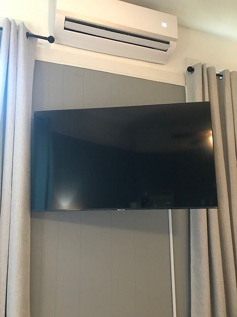 large tv is easily viewed from the sitting area or lying in bed.  The tv is connected to wi fi and is loades with many viewing options.