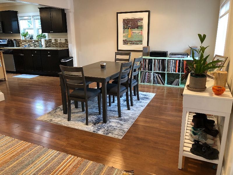 Open concept floor plan, with living/dining area leading into the kitchen. 