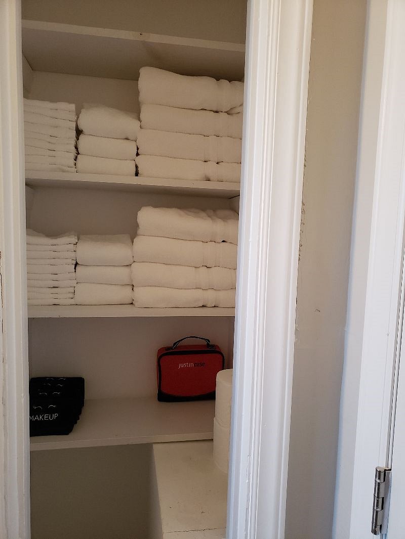 Hall Bath Linen Closet With Plenty of Towels and Storage
