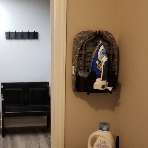 Compact/Expandable Ironing Board and Iron. Mud Room and Coat Rack in Back.