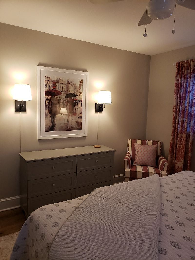 Large dresser adds plenty of storage. Dimmable lamps.