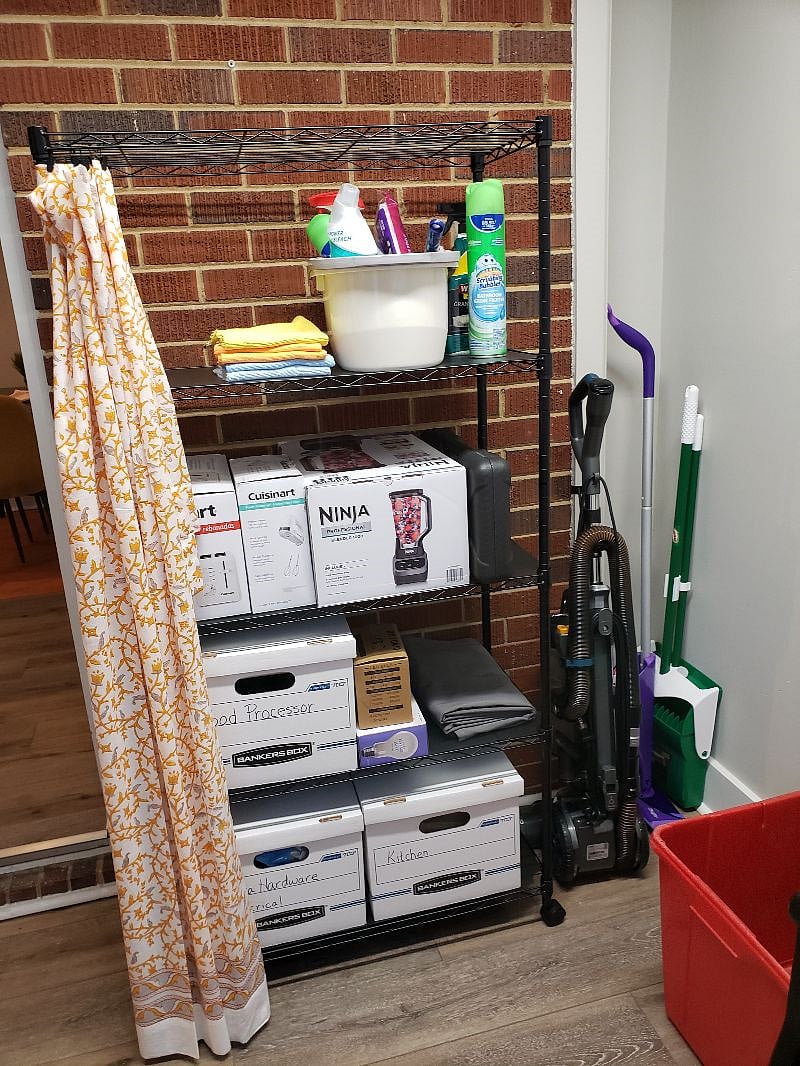 Mud Room Storage Rack with Brand New Hand Mixer, Blender, and Toaster.