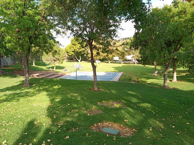 This is another view of the lush parks that are right around the corner from my home, this one has a basketball court.