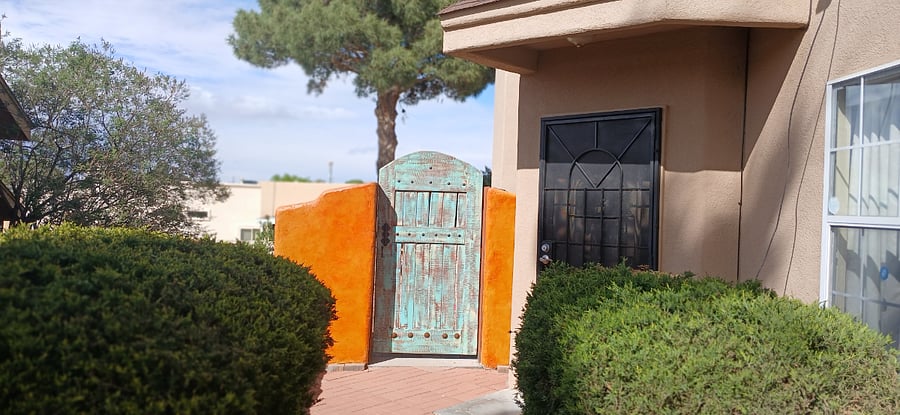 Being an old carpenter, I built this Santa Fe entry door to back yard putting green and added this old looking door I built as well.  On the other side of this door is entrance to my backyard I like keeping it locked from inside for more privacy.
