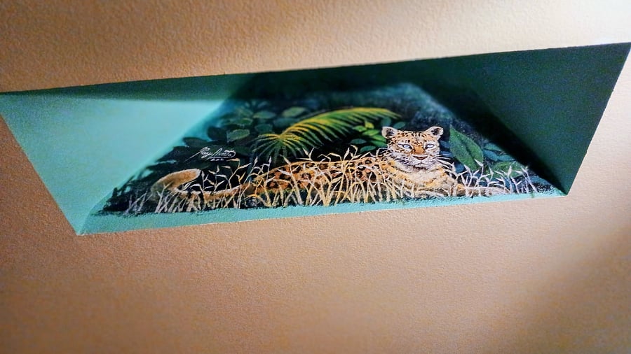 I have a vaulted ceiling with skylights in the living room where an artist friend painted a Jaguar resting there, I think it looks great.