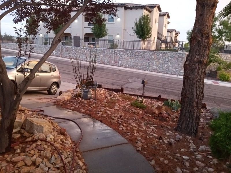 Street view from front yard both front and back yards have desert landscaping to conserve water.