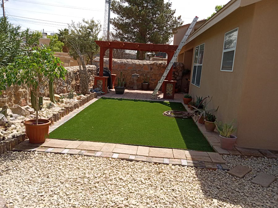 Fully remodeled backyard landscaping including pergola and patio furniture for outdoor bbqing.