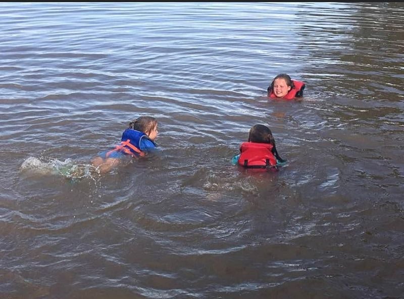 Swimming in the lake off the dock