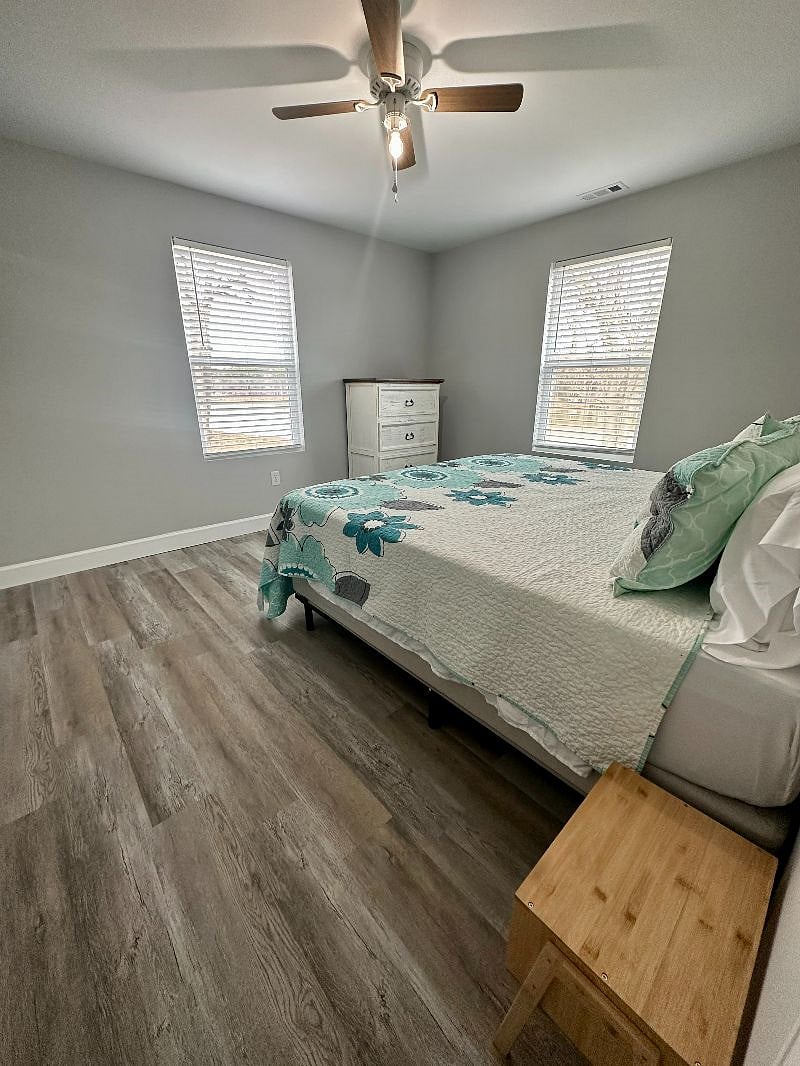 Bedroom 1 has a King bed, dresser, night stands and alarm clock