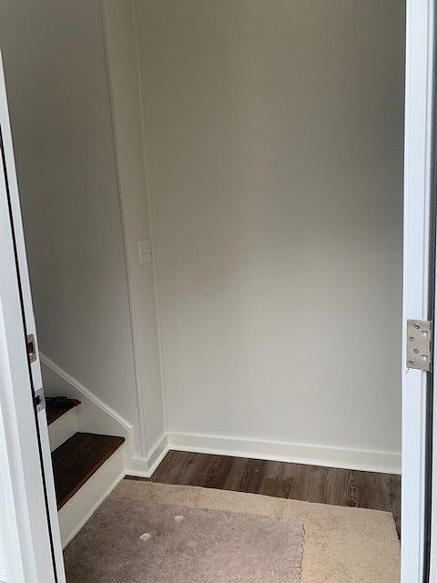 Bottom of stairs at entrance.