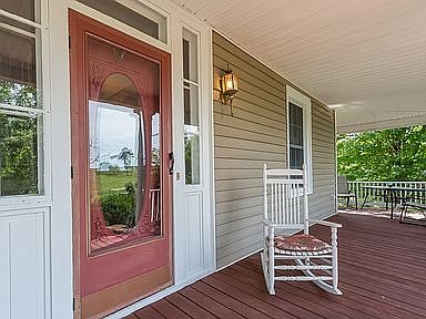 Front entrance faces south with wrap around porch