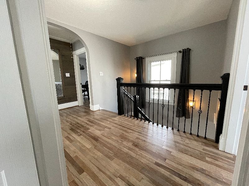 2nd floor hallway has a window to let in natural light.