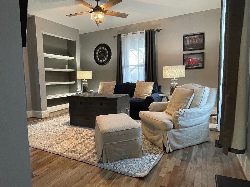 Living room offers a full size couch and rocking chair for relaxing.