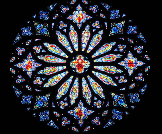 Saint John the Divine claims to be the largest cathedral in the world, defined as a church that is also the seat of a bishop. Measured by length or internal volume, it is one of the five largest church buildings in the world. Additionally, it possesses the largest rose window in the United States. The window, which is the fifth largest in the world, was constructed out of 10,000 pieces of stained glass.