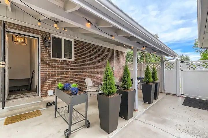 Dedicated Separate Entrance to your home away from home, including a dedicated patio with warm edison bulb lighting