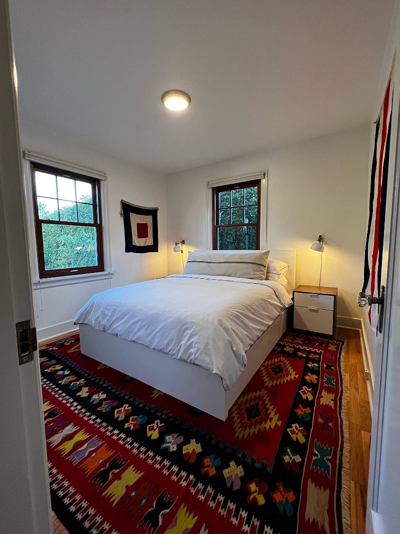 Bedroom with queen bed and views to the back courtyard. access to washer and dryer in bedroom.