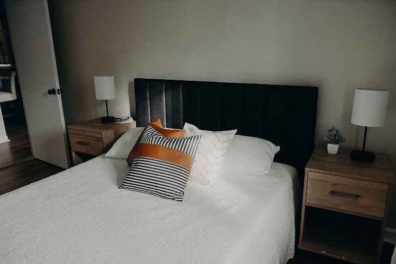 Queen size bedroom with small dresser and closet