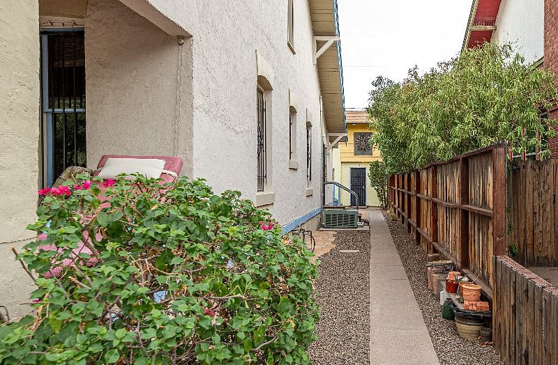 Side walking from from the front of the property back to Apt E and Laundry Room on the left.