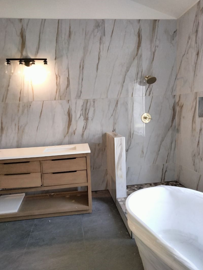 Master bathroom separate shower, tub, double sinks, slate tile, separate door for toilet, walk in closet. Glass doors to be installed soon.