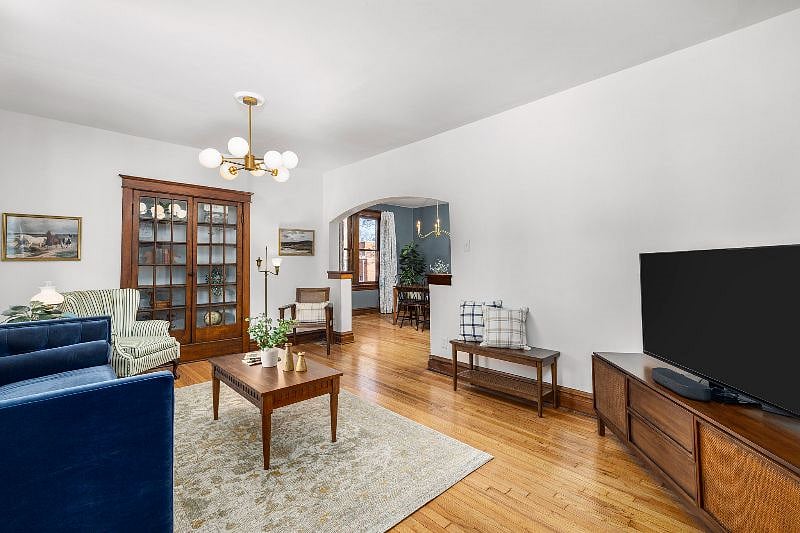 As you step in the front door you reach the spacious living room that opens up into the dining room.