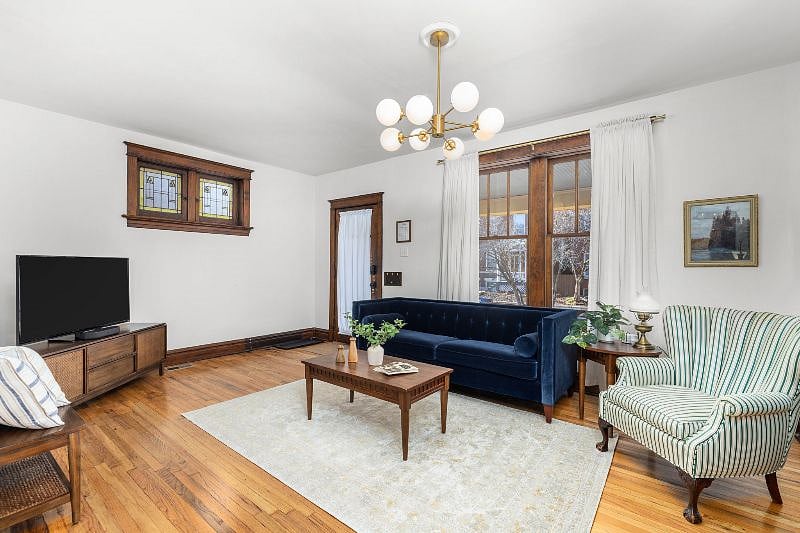 The living room features some original character of the home such as original stained glass windows, wood trim, and wood floors. Our ROKU TV and sound bar is provided for you to log in to your favorite streaming services.