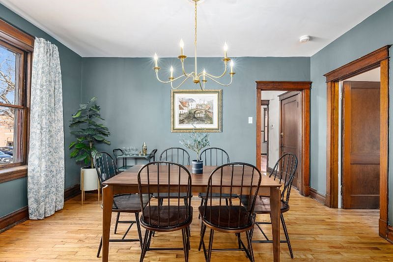 The spacious and bright dining room features a large table for 6.