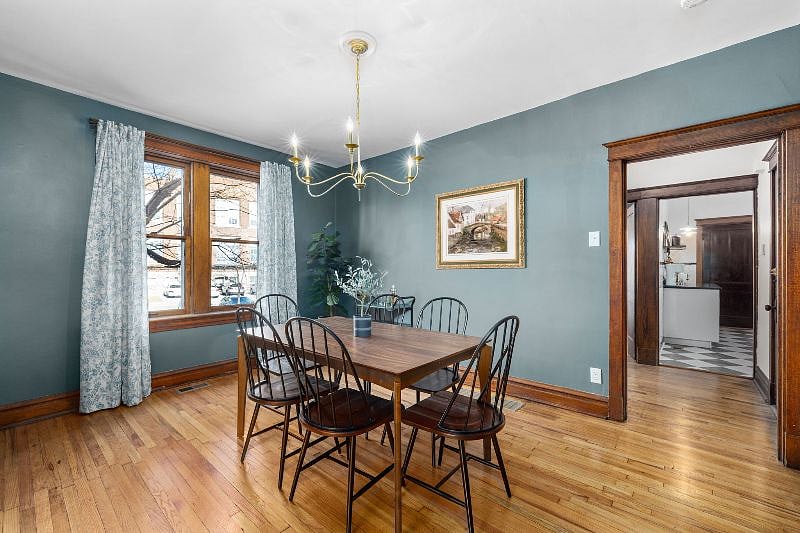 Off the dining room is one bedroom with a queen sized bed. through the back door way, you will reach the remaining bedrooms, kitchen and bathroom.