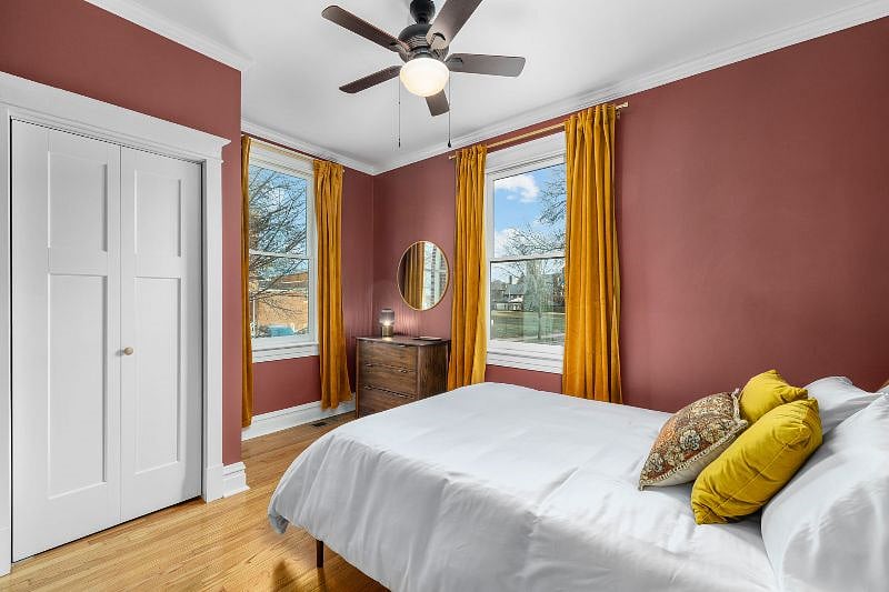 This bedroom provides a lot of light and space to get ready. This room also has black out curtains. Wall mirror and dresser provides a great place to do hair and makeup.