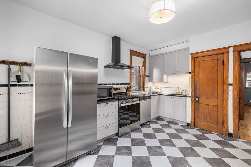 Newly updated kitchen with brand new stainless steel appliances and gas stove.