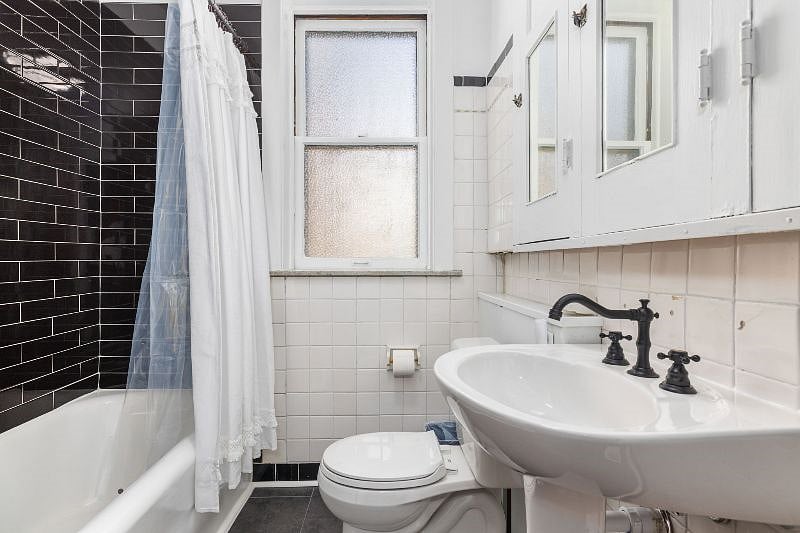 The bathroom features a full bath/shower and built in cabinets for plenty of storage.