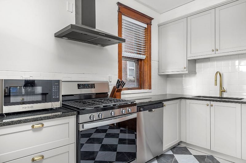 The kitchen is fully stocked with dinnerware, drinkware, and all the pots, pans, utensils you would need to cook a delicious meal.