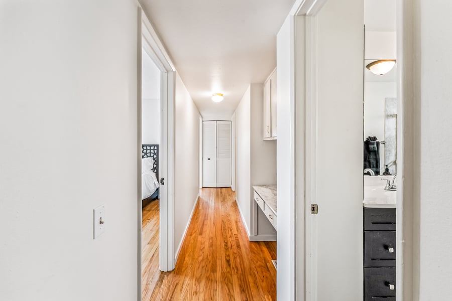 Walk the hallway to your three bedrooms.