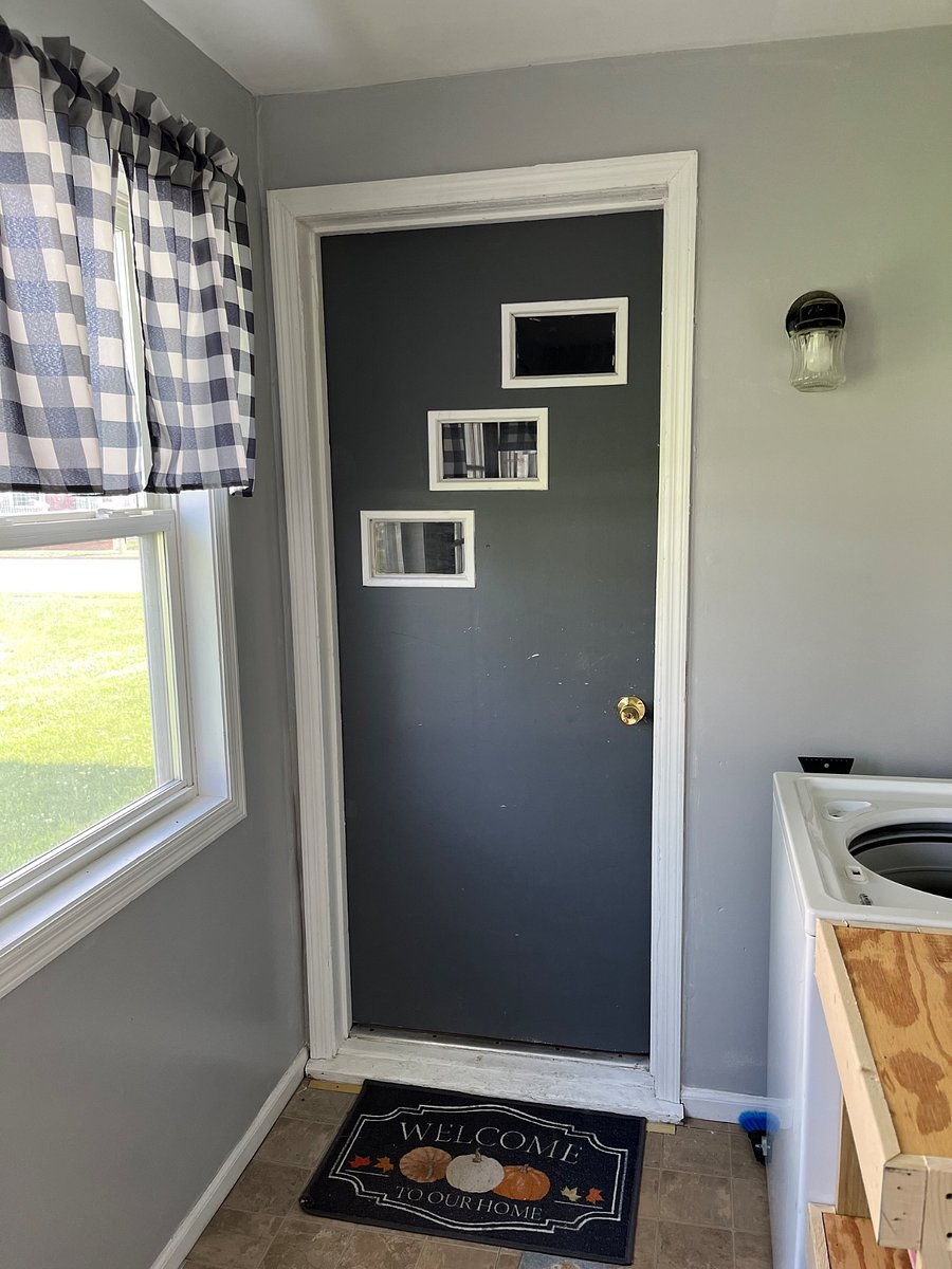 Door to the upstairs apartment. Common area has the washer and dryer.