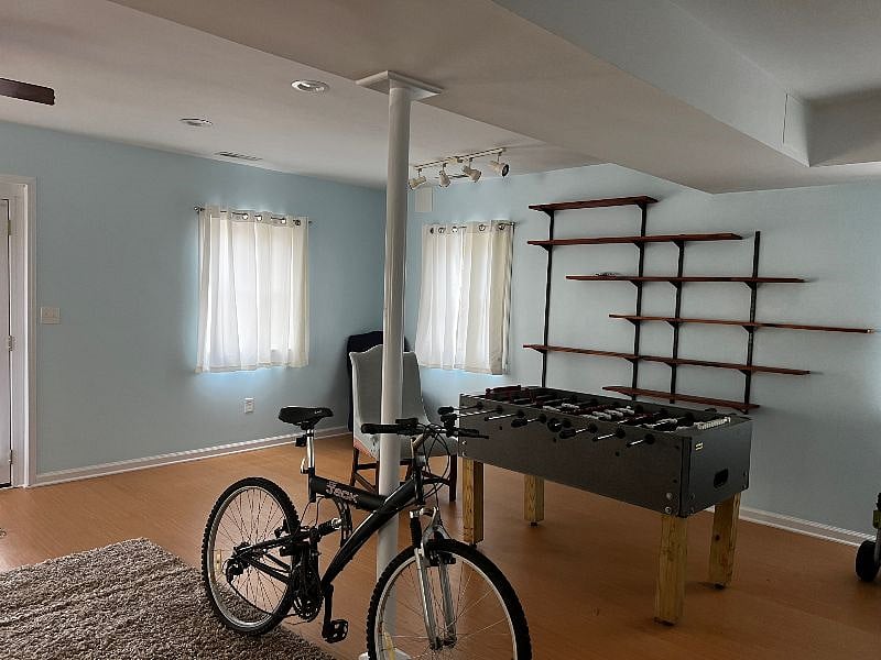 other side of the large room - bedroom area is to the left of this photo. We will move the foosball table out (unless you want it) and there is a love seat and chair now by the windows.. with a tv. TV runs off firestick