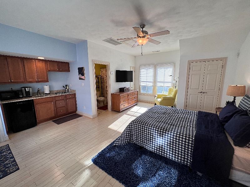 Main Living Space with view of Kitchen and Full size Bathroom
