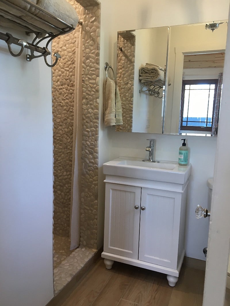 Spa like bathroom with rock shower, chrome fixtures, vent fan with heater for the rare chilly Phoenix mornings.