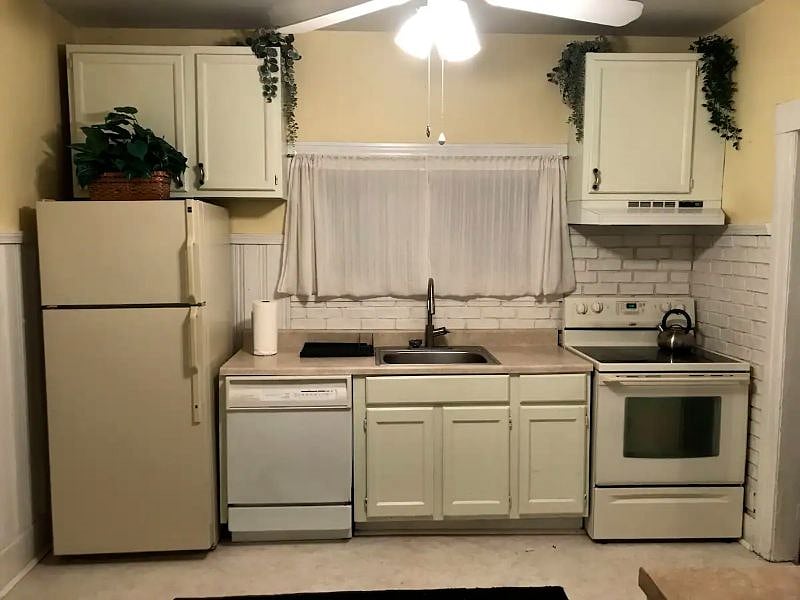 The light, airy kitchen comes with a refrigerator, range, dishwasher, microwave and coffee maker.