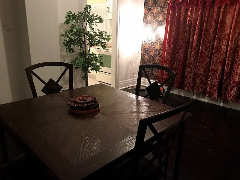 The dining room comes with a four-seater dining room table set.