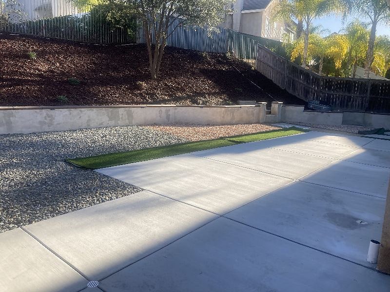 Newly renovated backyard with fencing and hardscape that is ideal for pets!