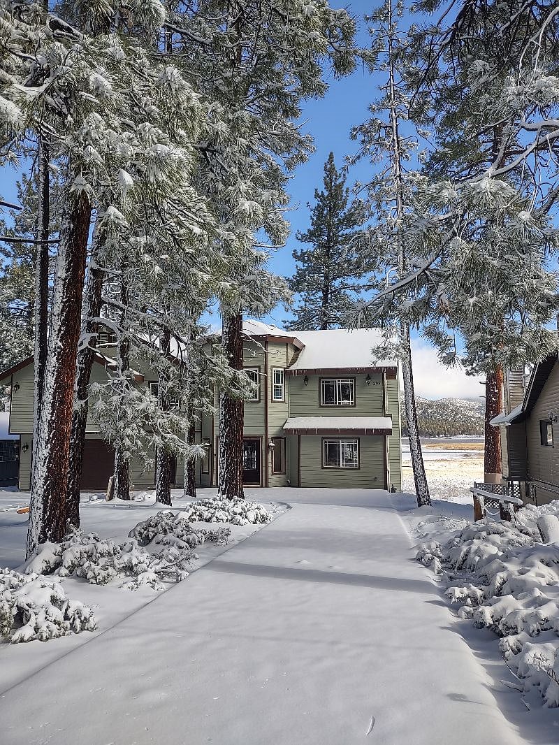 Our lake house tucked behind native pine treesBe 