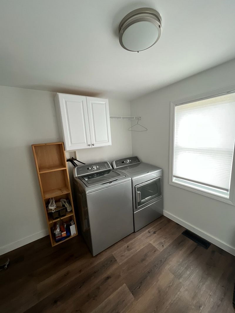 Laundry room also has desk and standing shelves.H