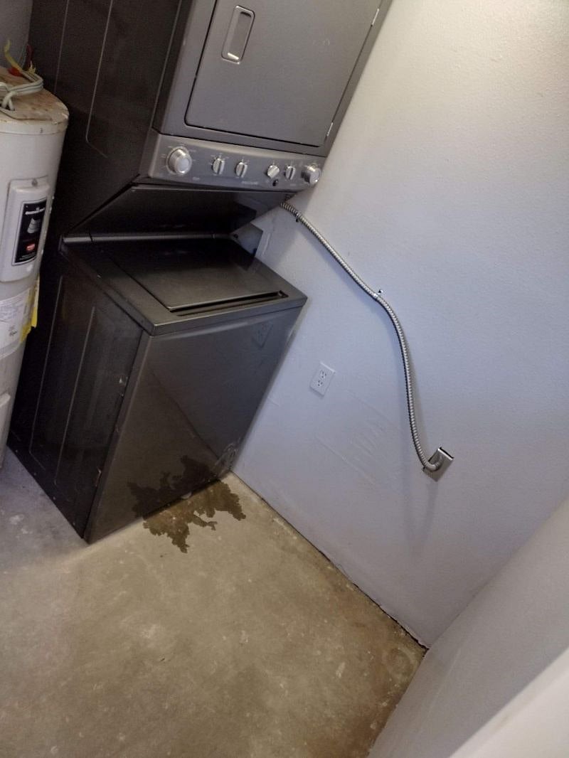 Full size load Stack Washer and dryer. Laundry room is located under balcony.