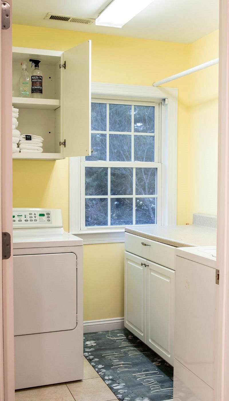 Laundry room across the hall from the large master bedroom
