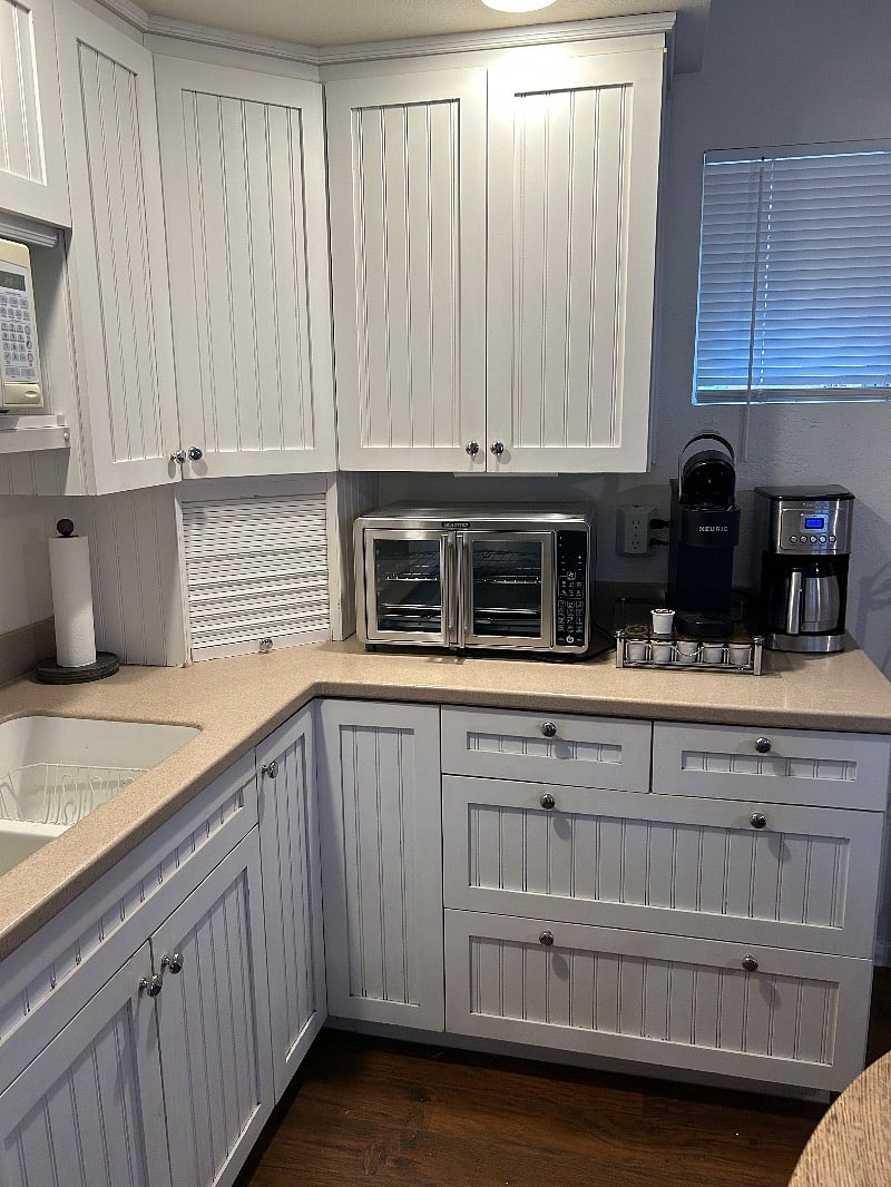 Kitchenette with countertop oven and different coffee options available