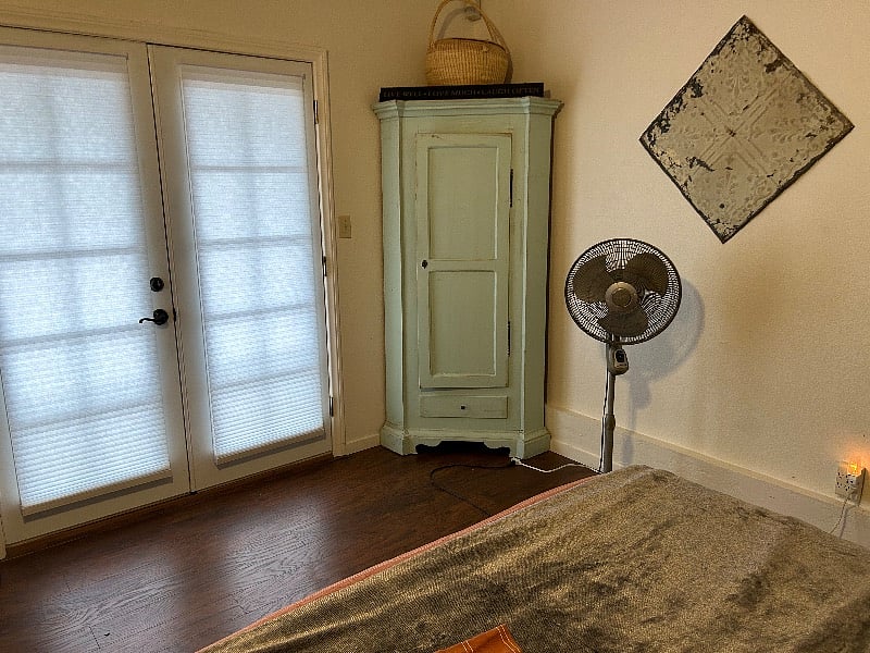 Other side of bedroom. French doors lead to pool area