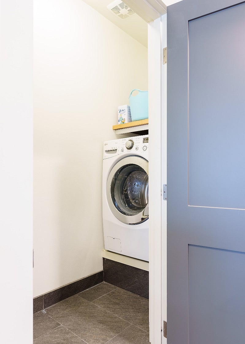 Front loading washer and dryer in unit. Lots of storage above the machines. Entry is off kitchen, just left of refrigerator.
