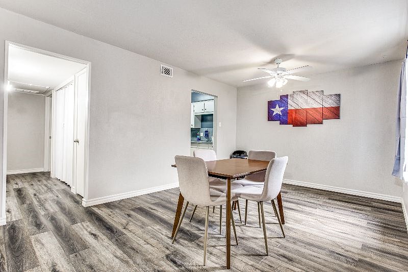 Enjoy a Delicious Home-Cooked Meal in the Contemporary Dining Room with Plenty of Natural Light Beaming Throughout
