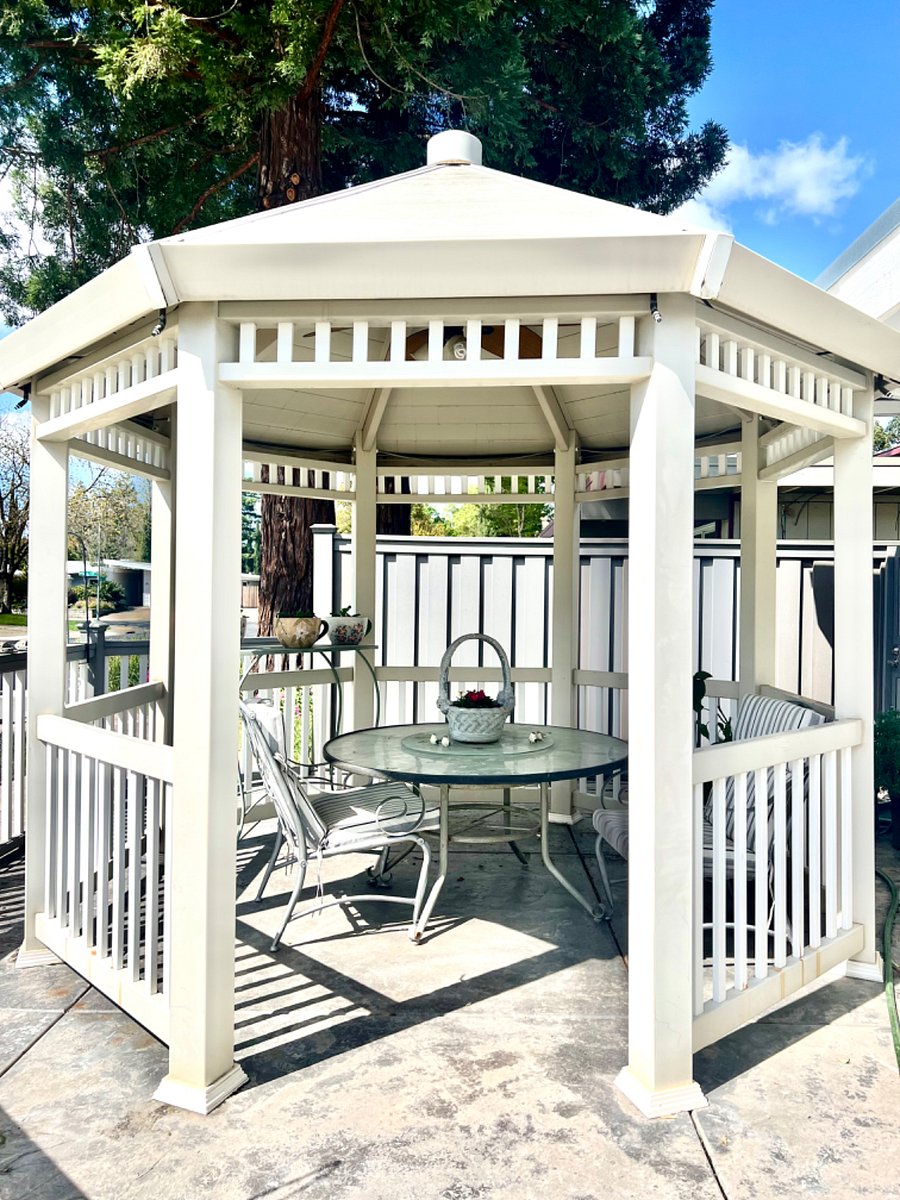 A front yard gazebo is a great spot to enjoy the outdoors and unwind. 