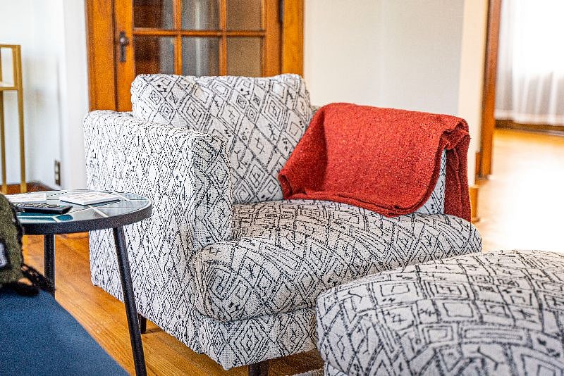 Cozy chair and ottoman in living room