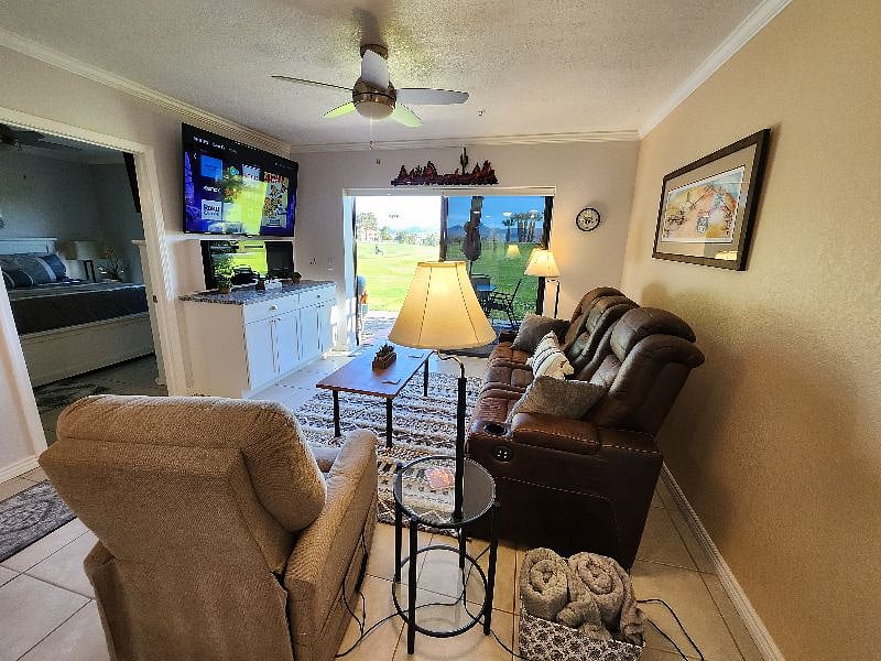 New living room furniture with slider out to the large patio on the golf course.